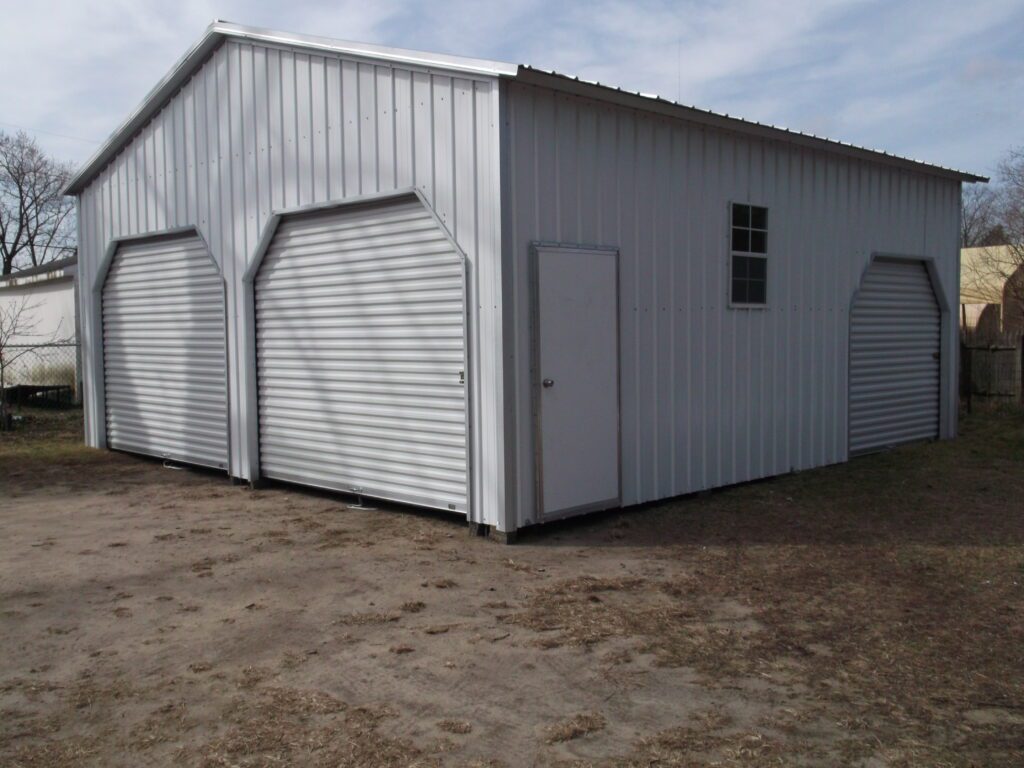 Photo of Fully enclosed A Frame with two roll up doors in the gable end, one 36″ walkin door Item # 62